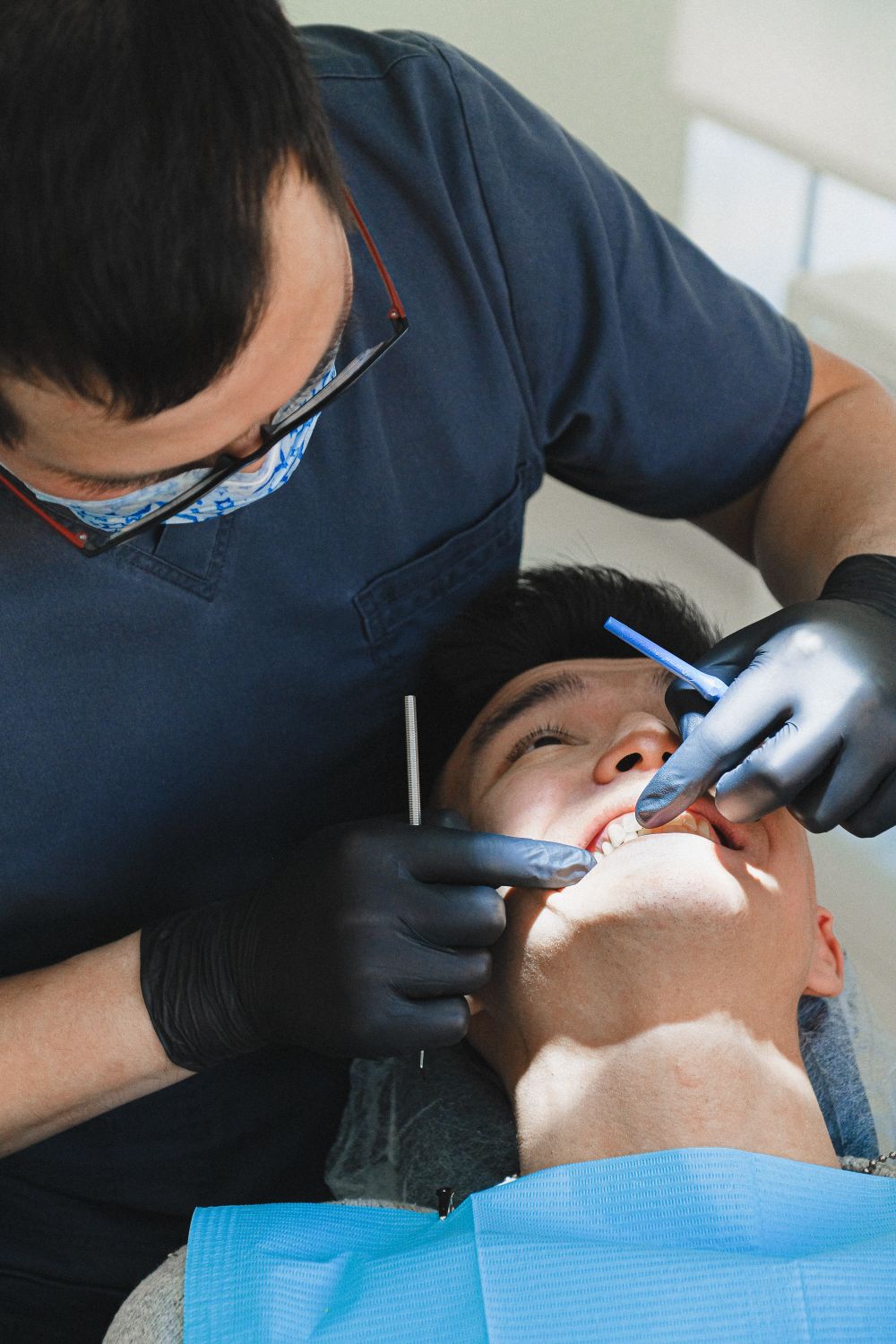 Dental Insurance Annual Maximum: Year-End Guide 1 Dentist treating a patient in a clinic, the kind of covered visit that counts toward a dental insurance annual maximum